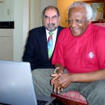 Firdaus Kharas and Desmond Tutu watching The Three Amigos