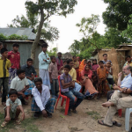 Firdaus-Kharas-talking-with-villagers-in-Bangladesh.png